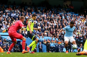 Aguero lifts the ball over Schindler to score the opener.