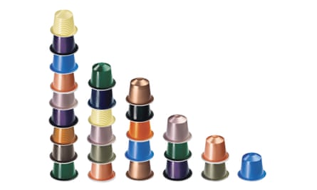 Nespresso capsules arranged in towers