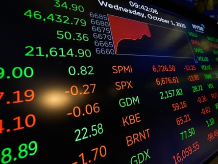 Financial data displayed in green and red lettering and digits on the floor at the New York Stock Exchange