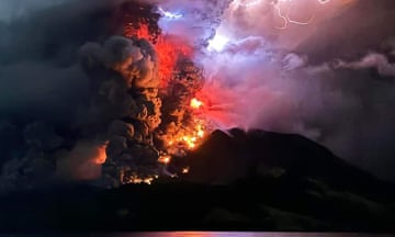 Mount Ruang in Indonesia’s southernmost region spews hot lava and smoke as the volcano erupts.
