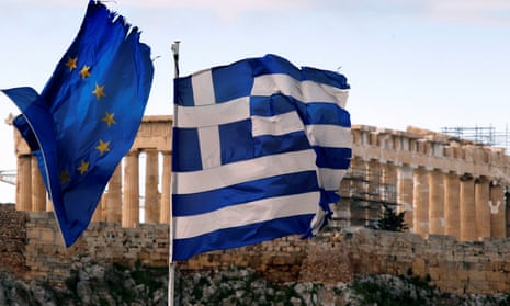 The Parthenon on the Athens Acropolis is seen behind a Greek and an EU flag