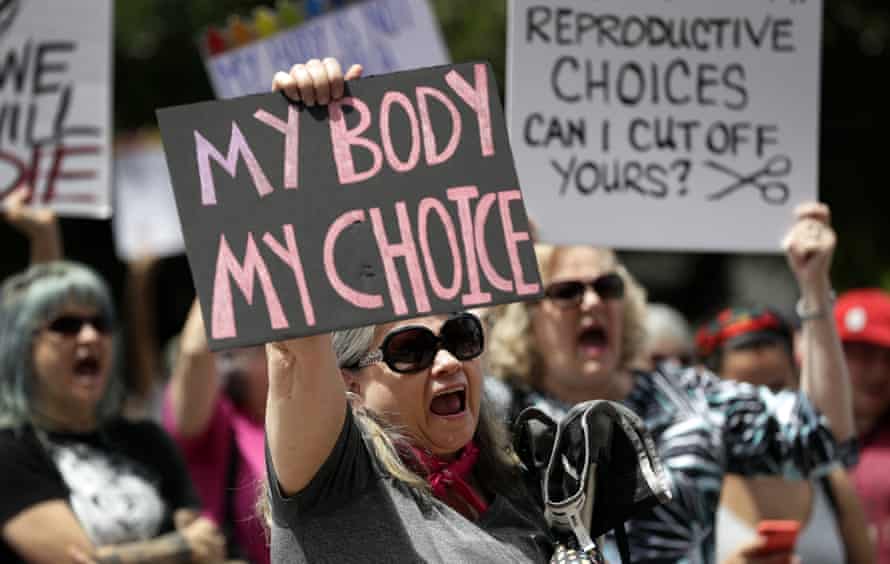 A group gathers to protest abortion restrictions at the state capitol in Austin, Texas, on 21 March 2019.