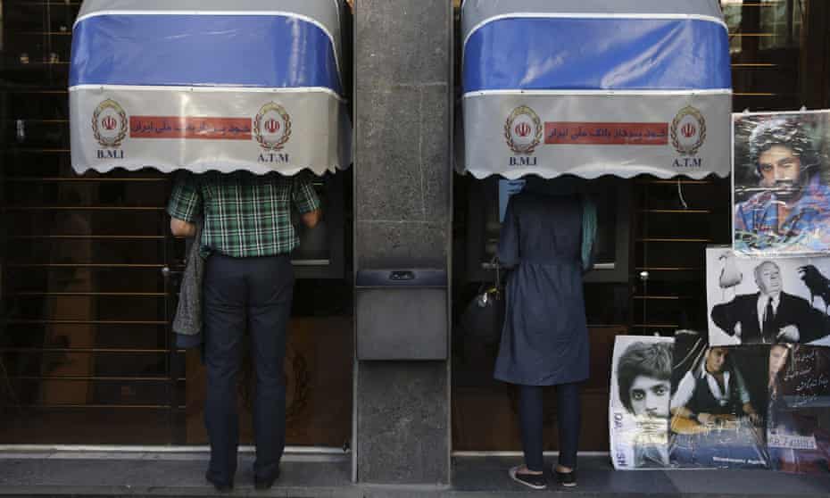 Iranians using Bank Melli Iran cash machines in Tehran