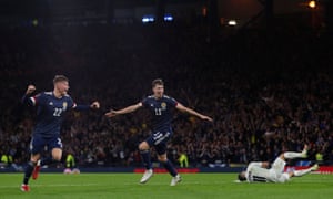 Scotland’s Nathan Patterson and Jack Hendry celebrate their third goal.