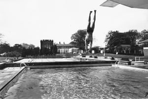Enjoying the lido at Alfreton, Derbyshire in May 1969. A man diving into an outdoor pool.  GNM Archive ref: GUA/6/9/1/1/S