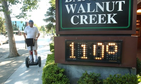 Mike Dupray rides his Segway scooter through town during a record-breaking heat wave in Walnut Creek, Calif., Saturday, July 22, 2006.