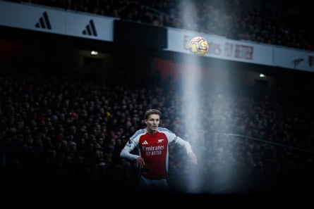 Arsenal’s Norwegian midfielder Martin Odegaard eyes the ball during a match against Nottingham Forest at the Emirates Stadium