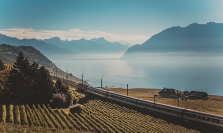 Railroad tracks with train in mountains of Lavaux Vineyard, Switzerland