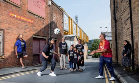 Members of the Bangla Bantams who are Bradford City FC fans pictured outside Valley Parade where the club play their home games. Pictured from left - Deepak Sharma, Luna Ali, Abu Saleh, Zafar Niaz with his children Nabeeha Niaz(6), Jemima Niaz(7) and Shamima Niaz(4), Humayun Islam and Shanaz Ali.