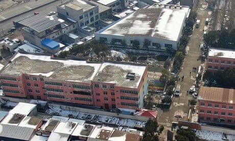 A drone image of the dormitory with charred windows at Yingcai school in Dushu, Henan province