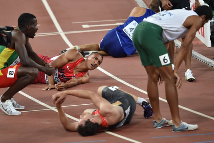 Gold medallist Ashton Eaton, top left, lies on the track with Kurt Felix, left, Larbi Bourrada, right, and Kai Kazmirek, front centre, after finishing the last event of the decathlon, the 1500m