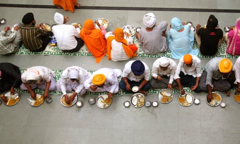 A langar or communal meal in a Sikh temple in Nanded, India. 