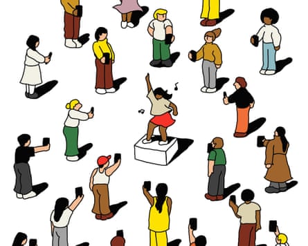 A woman dancing, surrounded by people filming her on their phones