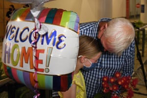 Charlotte Roempke welcomes her grandfather Bernie Edmonds as he arrives at Sydney international airport on Monday morning.