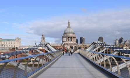 Pedestrians cross the Millennium Bridge in a quiet London, as it enters a new phase of lockdown.