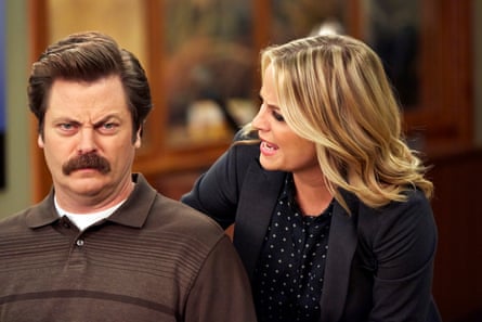 Playing Ron Swanson, with Amy Poehler as Leslie Knope.