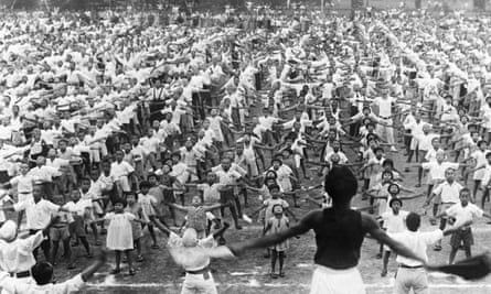 A mass calisthenics exhibition staged by children in a Tokyo park on the occasion of the 2,600th anniversary of the Japanese Empire’s founding.