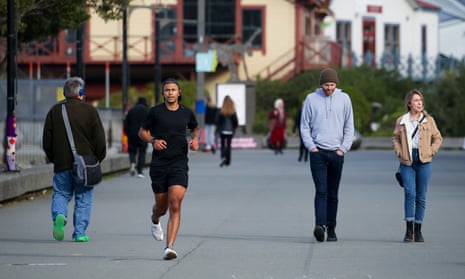 Members of the public exercise along the waterfront in Wellington