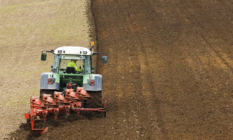 A tractor ploughing the soil