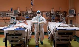 A doctor attends to patients in intensive care in the Covid-19 ward of the Maria Pia hospital in Turin.