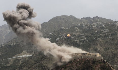Smoke rises from al-Qahira castle as another building on the Saber mountain, in the background, explodes after Saudi-led air strikes in Taiz city, Yemen.
