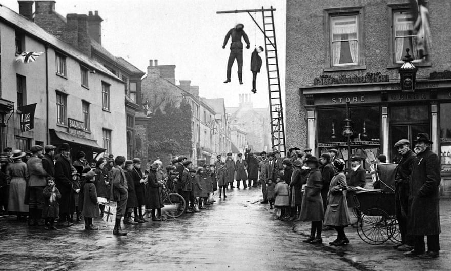 Effigies of the Kaiser, Wilhelm II, and his son, ‘Little Willie’, are hanged in Brackley, Northamptonshire on Armistice Day.