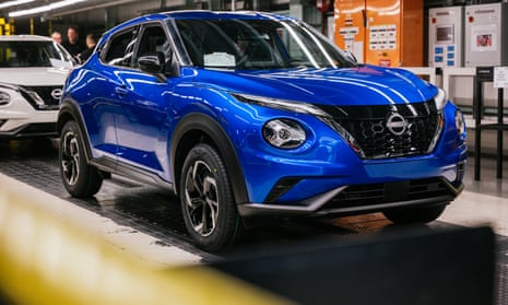 A bright blue hybrid Nissan Juke SUV on the production line at the Nissan factory in Sunderland, UK,pictured in 2023.