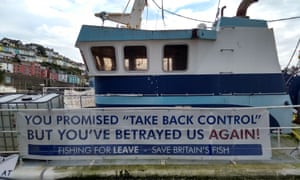 BRITAIN-FRANCE-EU-BREXIT-FISHINGA picture shows a ‘Fishing For Leave’ campaign group sign about Brexit on a boat in the harbour in Brixham, southern England, on October 11, 2018. - Tensions are already high between the French and British fishing fleets due to the scallop wars but Brexit could change the game completely by redrawing the battle lines in the Channel. French fishermen are anxious to avoid a hard Brexit that could shut them out of British territorial waters, while in UK ports, trawlermen hope such moves could reinvigorate the British fishing industry. (Photo by Robin MILLARD / AFP)ROBIN MILLARD/AFP/Getty Images 4160.jpg?width=300&quality=85&auto=forma