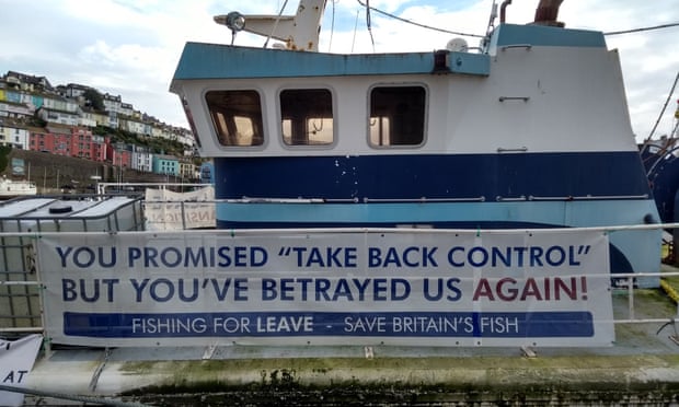 BRITAIN-FRANCE-EU-BREXIT-FISHINGA picture shows a ‘Fishing For Leave’ campaign group sign about Brexit on a boat in the harbour in Brixham, southern England, on October 11, 2018. - Tensions are already high between the French and British fishing fleets due to the scallop wars but Brexit could change the game completely by redrawing the battle lines in the Channel. French fishermen are anxious to avoid a hard Brexit that could shut them out of British territorial waters, while in UK ports, trawlermen hope such moves could reinvigorate the British fishing industry. (Photo by Robin MILLARD / AFP)ROBIN MILLARD/AFP/Getty Images