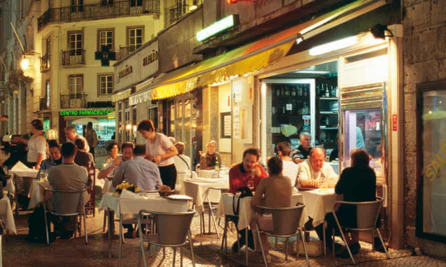 Narrow streets of Baixa district such as Rua Portas S Antao crowded with small restaurants