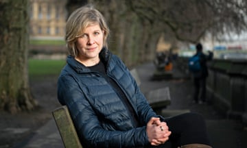 Josie Stewart pictured sitting on a park bench near Westminster