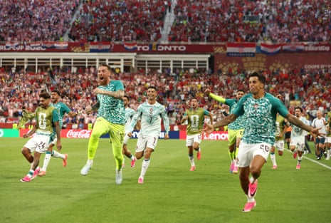 Cristiano Ronaldo celebrates with teammates after his team scored their second goal in stoppage time.