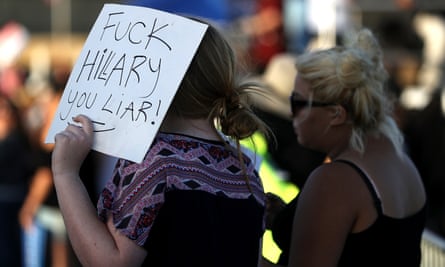 A Bernie Sanders supporter holds an anti-Hillary Clinton sign during a campaign rally.