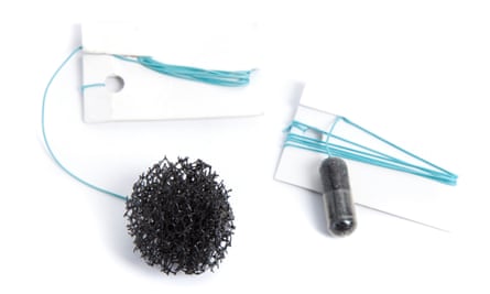 Two kits for a ‘sponge on a string’ test, one with the sponge inside a capsule the other with the sponge expanded.