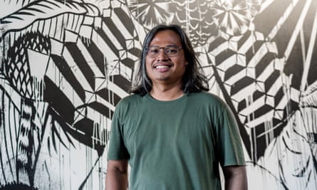 Eko Nugroho with his mural Now What Else?
