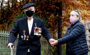 Second world war veteran Malcolm Clerc, 94, who served in the Navy Atlantic convoys, is seen with his daughter, Sally, after a socially distanced remembrance service in Knutsford, Cheshire