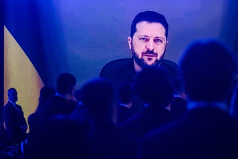 Volodymyr Zelenskyy speaks to the audience via an online video call during the opening ceremony at the Warsaw Security Forum.