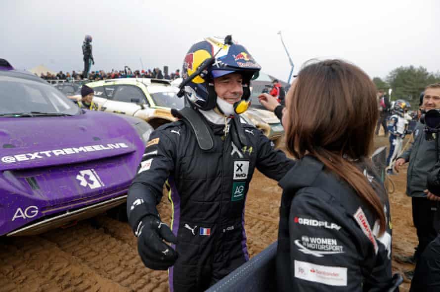 SÃ©bastien Loeb of the X44 team celebrates the victory with his co-driver Cristina Gutierrez.