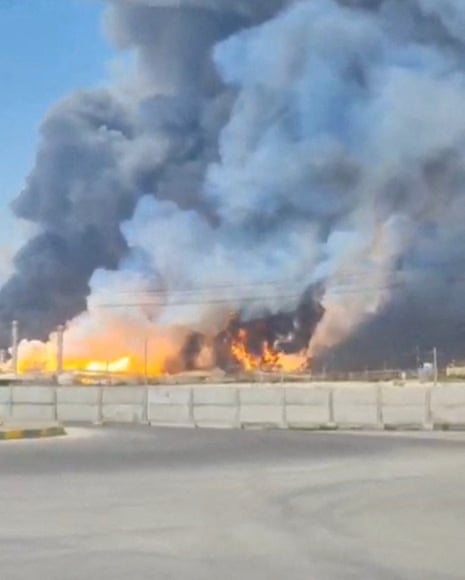 Smoke and fire rise near the South Pars gas field following an attack, amid the U.S.-Israeli conflict with Iran, in Bushehr Province, Iran, March 18, 2026, in this screen-grab obtained from a social media video.