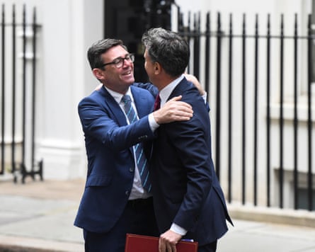 Andy Burnham embraces Ed Miliband.