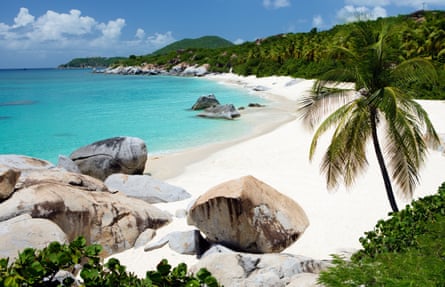 Beach with boulders and palm trees in Virgin Gorda, British Virgin Islands