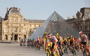 The pack rides in front of the Louvre.