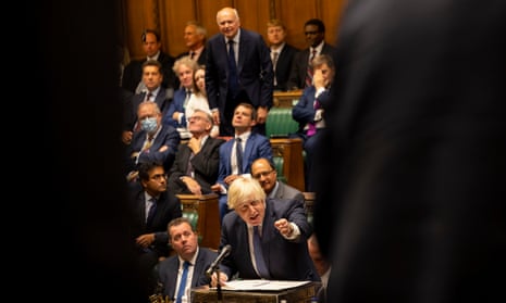 Boris Johnson glimpsed on the other side of the Commons chamber framed between the shoulders of two opposition MPs, gesturing at the dispatch box while the Tory MP Iain Duncan Smith rises behind him, seeking to intervene