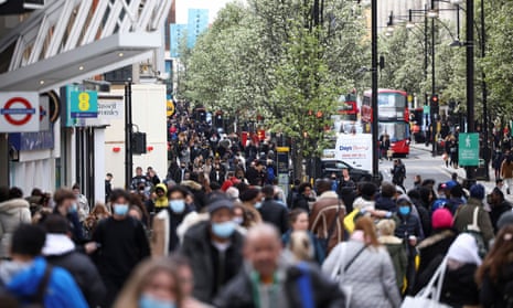 The coronavirus disease (COVID-19) restrictions ease, in LondonPeople walk at Oxford Street, as the coronavirus disease (COVID-19) restrictions ease, in London, Britain April 12, 2021. REUTERS/Henry Nicholls