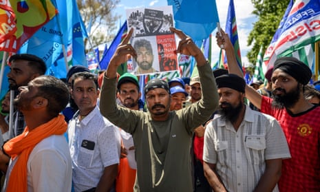 Protesters in Rome holding signs against labour exploitation