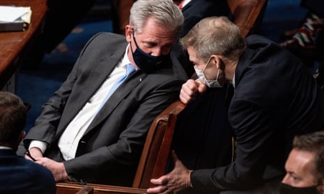 House Minority Leader Kevin McCarthy (R-CA), left, and Representative Jim Jordan (R-OH), right, talk during a joint session of Congress to certify the 2020 Electoral College results after supporters of President Donald Trump stormed the Capitol earlier in the day on Capitol Hill in Washington, DC, 06 January 2021.