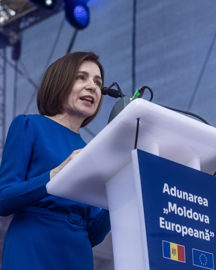 Maia Sandu speaks from a podium labelled 'Adunarea "Moldova Europeană" '