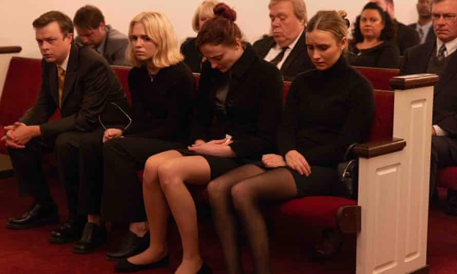 Young, second from left, plays Martha at Kathleen Peterson's funeral in The Staircase