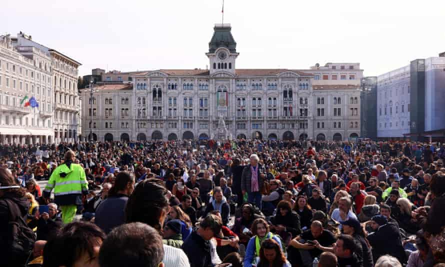 People demonstrate at the Unity of Italy Square (Piazza Unita d’Italia), as Italian riot police try to disperse the protest which has taken place for several days.