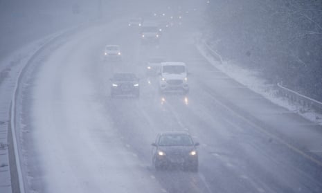 Cars driving through snow on the northbound carriageway of the M5 motorway near Taunton, which has been reduced to two lanes due to snow, as parts of the UK wake up to snow and a yellow weather warning.